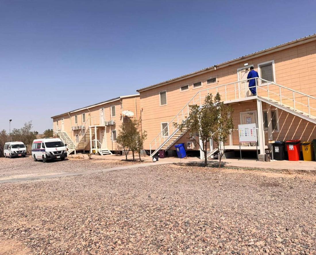 Two-storey accommodation blocks in an oilfield camp