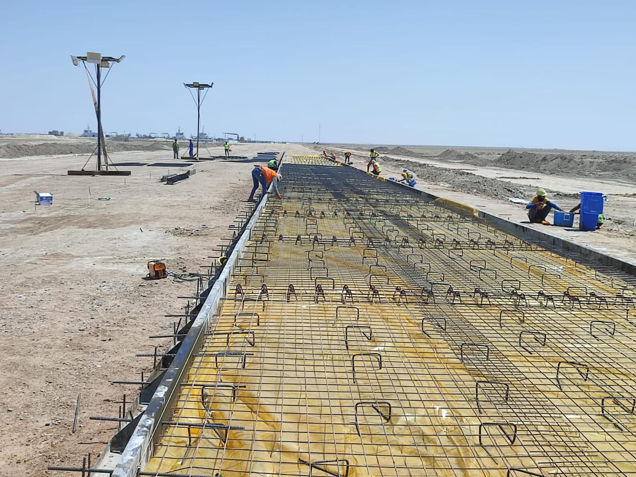 Steel reinforcement laid for concrete road paving