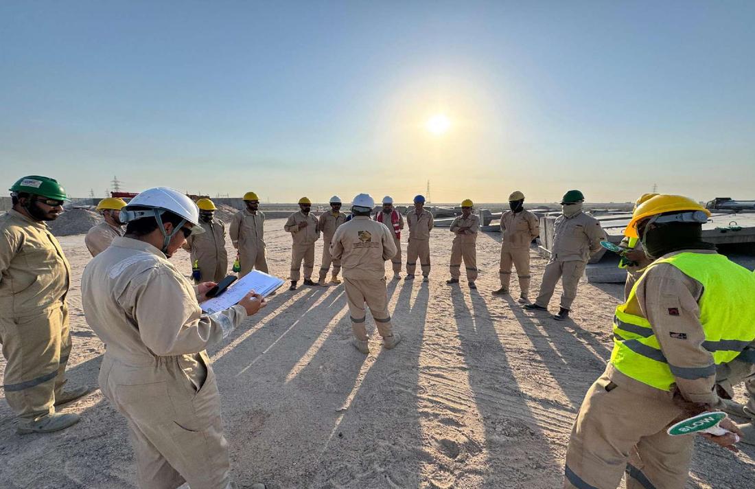 Morning toolbox talk with the site crew
